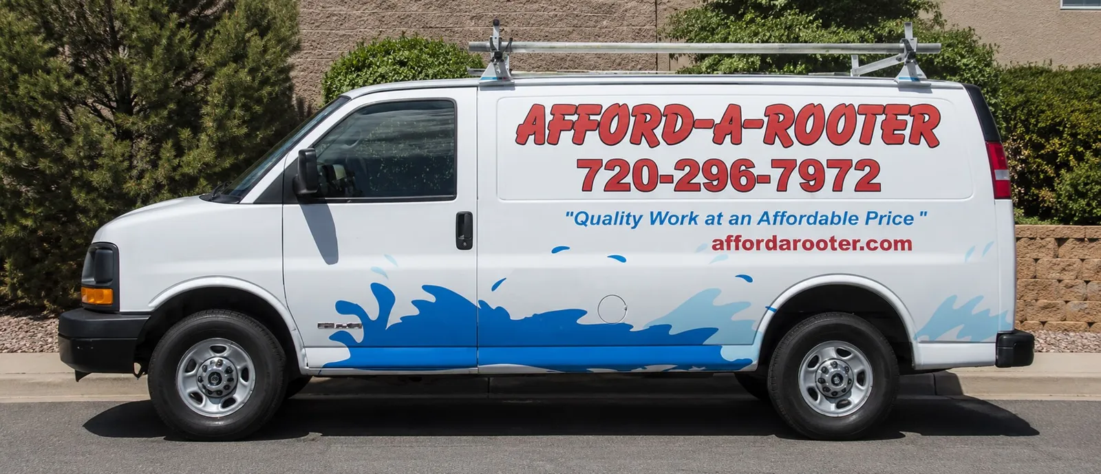 Afford-A-Rooter Plumbing service van parked outside a Denver area home